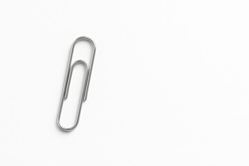 Obraz premium Hyper-realistic mockup of an office paperclip on a white background in a minimalist design for branding with copy space.