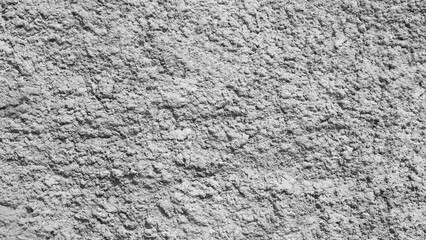 White gray wall with cracks and holes. wall is covered with white paint and has rough texture background for  web banner template page