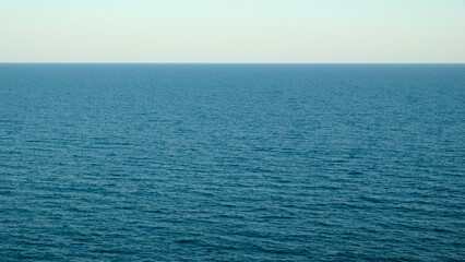 Fototapeta premium Blue sea waters and clear blue sky horizon.