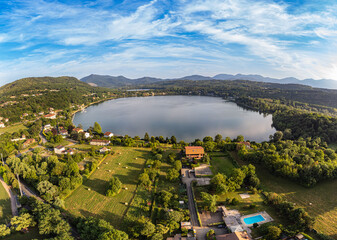 Aerial sunset view of Avigliana lake, Italy, Piedmont, Turin, Italy A beautiful town with and...