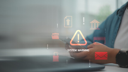 Cybersecurity system warning on mobile device, with alert icons indicating potential threats or data breaches. Concept of digital security risks, hacker alerts, and online protection awareness.