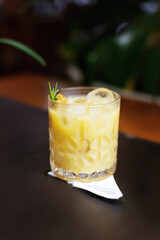 colorful fruity cocktails with decoration in a medium-sized, round glass.