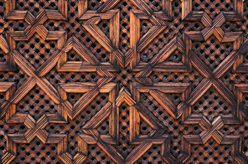 Medina of Fez, Morocco. Intricately carved wooden panel with elaborate Arabesque symmetrical design.