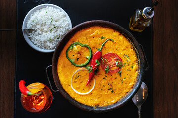 Shrimp, a typical food from the Brazilian Northwest made with shrimp and dendé oil, with tomato...