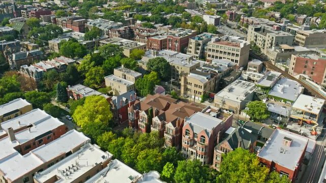 Aerial view of a residential neighborhood with lush green trees in chicago