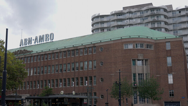 ROTTERDAM, NETHERLANDS - SEPTEMBER 13, 2025 - ABN AMRO bank building with brick facade and green roof in urban Rotterdam