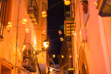 old street in the city with hanging lights
