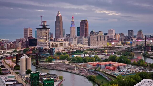 Panoramic view of the cleveland skyline at dusk with river in the foreground