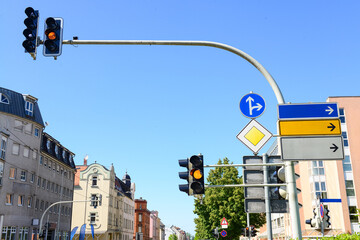 View of traffic lights with road signs in city