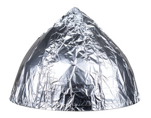 A shiny metallic dome-shaped object made of aluminum foil, reflecting light in various directions, creating a unique visual.