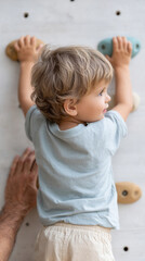 Child climbing adventure on indoor rock wall - encouraging active play and growth