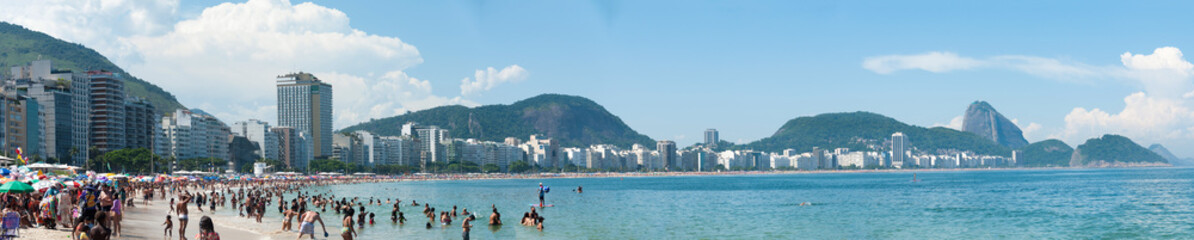 On Copacabana Beach, the sun shines brightly, the white sand invites rest, and the sea water...