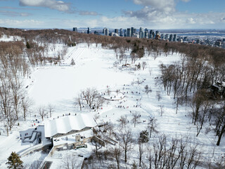 View of the skating rink and downtown in winter from Mont Royal, Montreal. Quebec, Canada