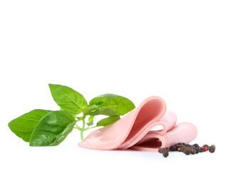 Slices of tasty boiled sausage with basil and peppercorns isolated on white background