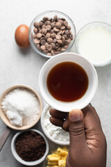 Overhead view of cup with coffee on a white background