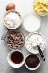 Overhead view of mise en place of ingredients for making chocolate tart, process of make chocolate ganache tart