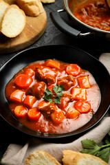 Goulash or Gulasch. Meat stew with carrot, potato, and spices.