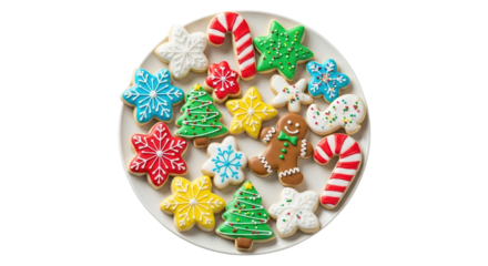 A plate full of assorted christmas decorated cookies including gingerbread men, candy canes, and trees, isolated on transparent background