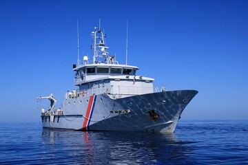 Fototapeta premium Vessel Kermorvan in open waters, a beautiful French Customs patrol boat built by the Socarenam shipyards in Boulogne-sur-Mer, the Kermorvan entered service in 2008.