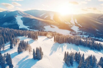 Aerial view of a snowy mountain resort at sunset