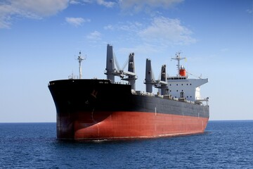 View of a bulk-carrier ship anchored in Alicante Bay, in the Mediterranean Spanish port of Alicante. © Jose Lledo