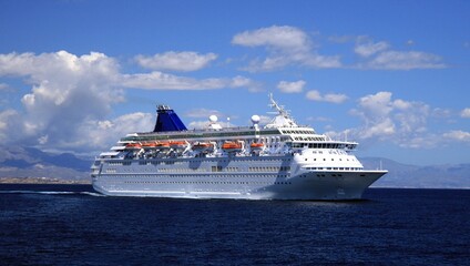 Great cruise ship sailing close to the port of Alicante, in the Mediterranean coast of Spain.