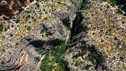 Aerial view of the narrow gorges and ravines created by the Amadorio River as it passes through the village of Relleu, Spain.