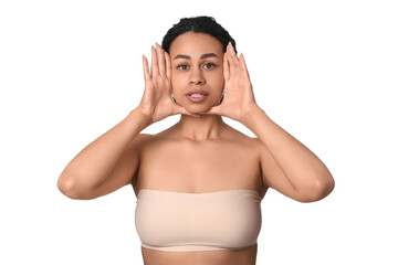 Obraz premium Young African-American woman doing face building exercise on white background