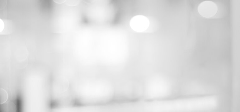 Blur white abstract background, blurred grey gradient bright light with copy space backdrop, banner, blank modern business office interior hallway building design background, monochrome