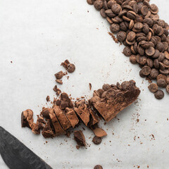 top view of chocolate chips on a white background