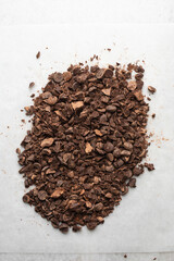 Overhead view of chopped dark chocolate for baking, top view of chocolate chunks