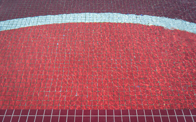 Red Swimming Pool Water with Tile Pattern. Top view.
