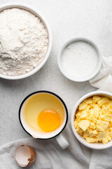 Overhead view of mise en place of ingredients used to make tart shell dough, top view of items used to make pie crust dough