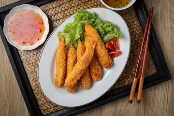 Fried breaded shrimps in white plate