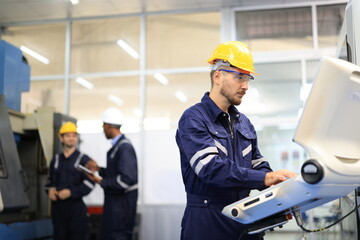 Engineer control machine, factory engineer controlling and pressing important technology button at control panel of an automatic machine in the manufacturing. Robot AI manufacturers.