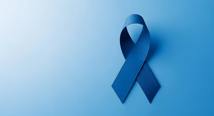 Prostate Cancer Awareness Campaign Concept. human Healthcare. Close up of a Blue Ribbon Lying on blue background, Top View