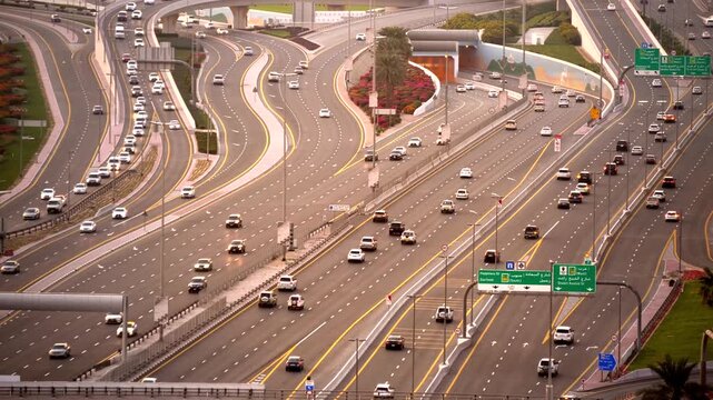 A dynamic urban highway traffic scene showcasing multiple lanes accommodating diverse vehicles