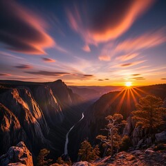 Fototapeta premium A breathtaking vista of a canyon at sunset, showcasing dramatic mountain ranges and a winding river, bathed in warm golden light.