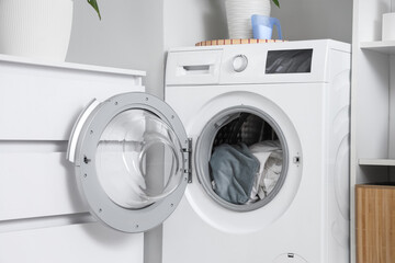Washing machine with bed sheets in laundry room