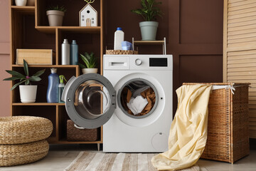Interior of laundry room with washing machine, shelf unit and basket
