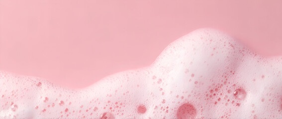 Fototapeta premium A close-up view of pink foam against a pastel background, perfect for beverage themes.