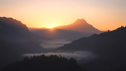 Obraz premium Mountain sunrise casting golden light over misty valleys in a serene morning landscape.