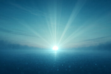 Ethereal morning glow as the sun rises through the fog, casting brilliant blue rays across a serene and tranquil horizon