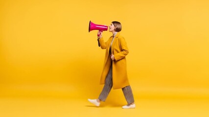 Young woman in yellow coat walking and shouting through a pink megaphone on a vibrant yellow background. - Powered by Adobe