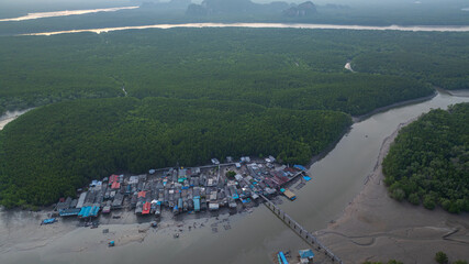 Sunset above Amazing a fishing village that lives on a small, isolated island. mangrove forests on...