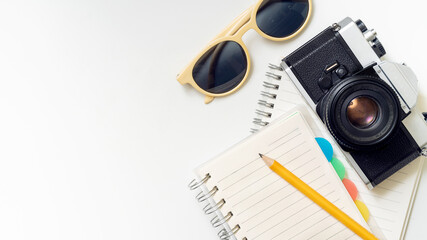 Plan your next adventure with this vintage camera and notebook, perfect for travel blogging,...