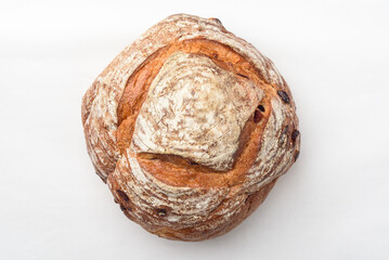 Freshly baked sourdough bread on white background, high angle view
