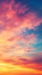 Fototapeta premium Vivid Sunset Sky with Fiery Orange, Soft Pink, and Deep Blue Clouds Formations