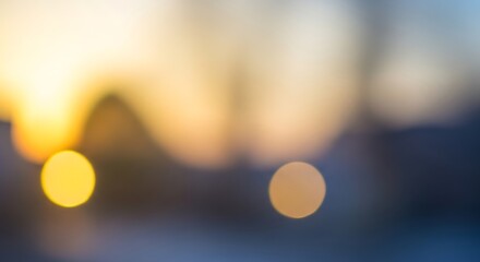 Soft-focus sunset scene shows blurred shapes and warm colors, creating a peaceful and tranquil ambiance.
