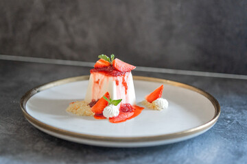 Elegant Panna Cotta Dessert with Fresh Strawberries and Cream